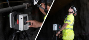 Surveyor wearing bright safety gear uses a laser scanner inside a dark rail tunnel