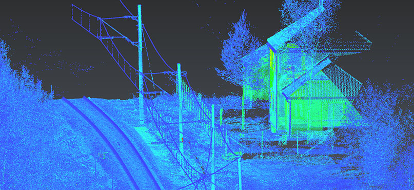 3D point cloud image of a road, building, trees and utility lines. 