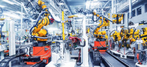 Robotic machines at work in an automotive facility